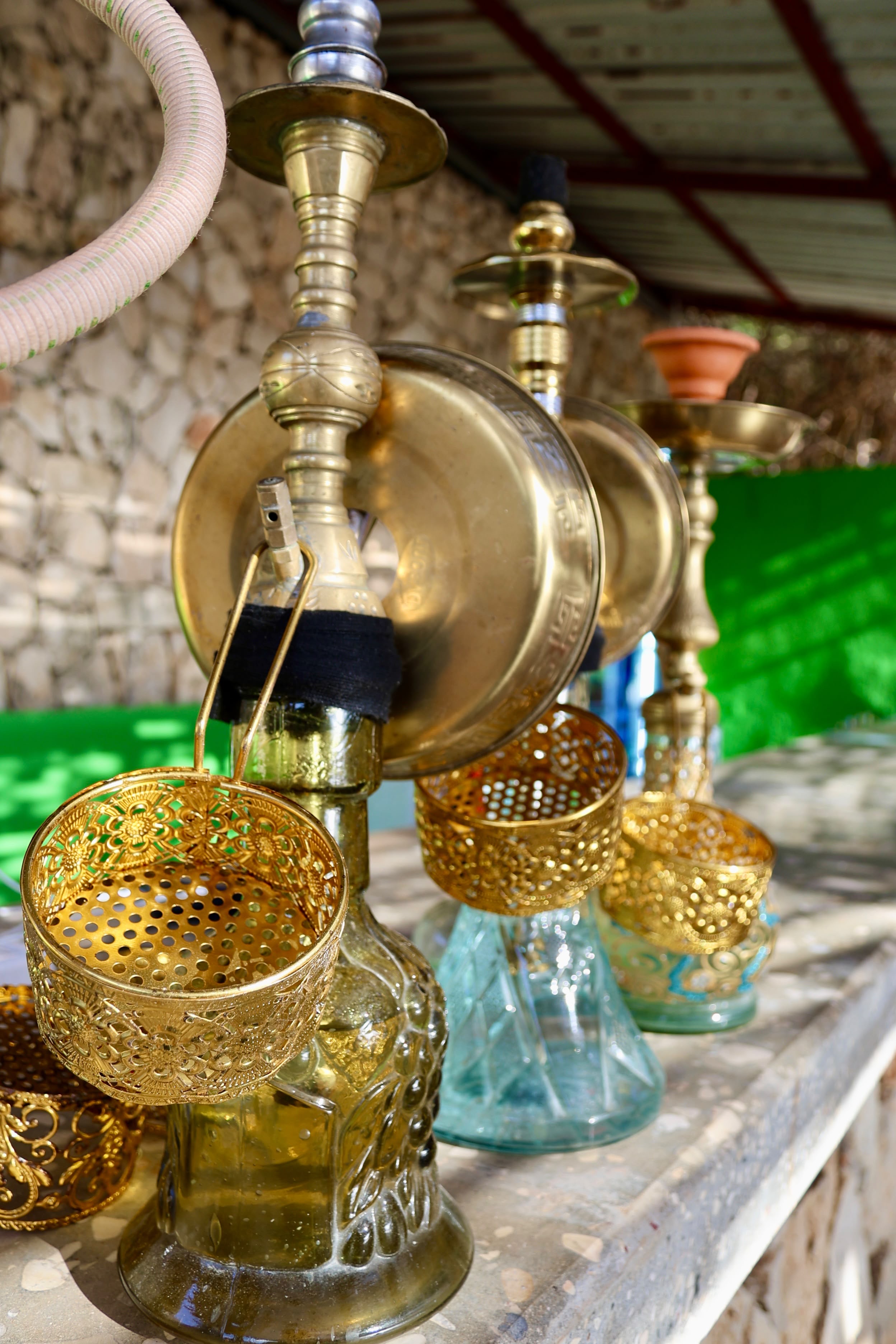 Gold shisha pipes lined up at Side B Beach Club